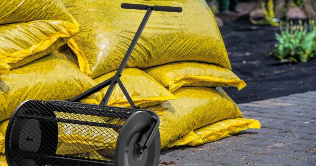 Black Compost Spreader With Yellow Bags Of Compost